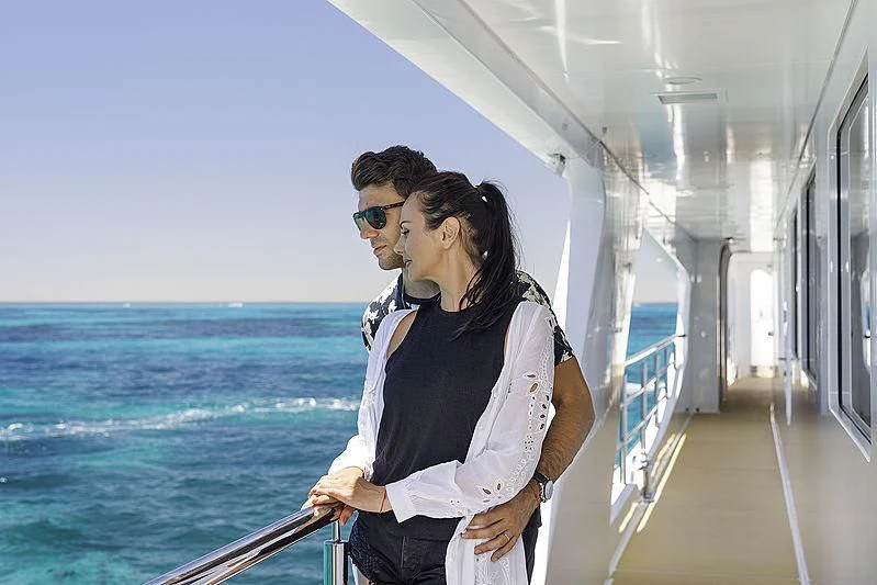 a man and woman kissing on a boat aboard CHARLEY Yacht for Sale