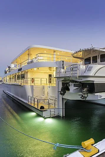 a large building with a pool aboard CHARLEY Yacht for Sale