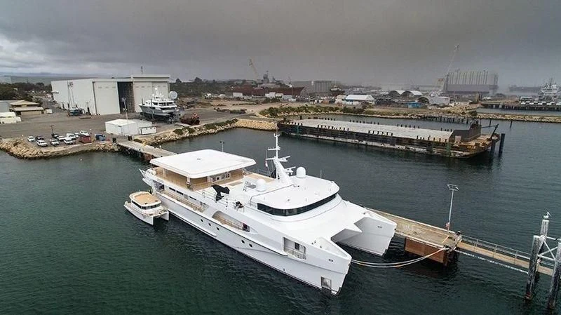 a large ship docked at a port aboard CHARLEY Yacht for Sale
