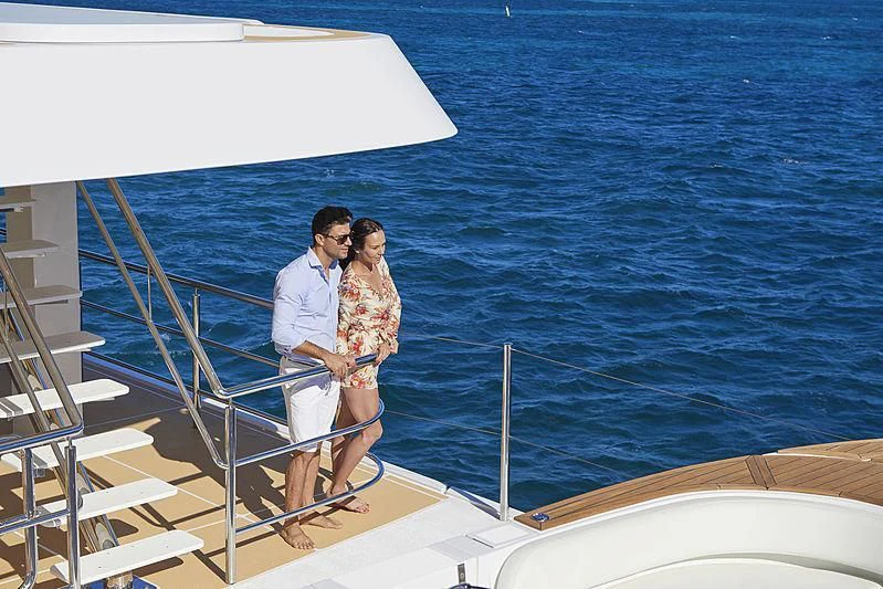 a man and woman on a boat aboard CHARLEY Yacht for Sale