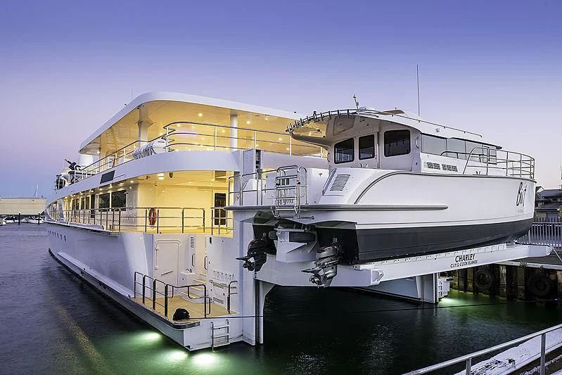 a large white boat on a dock aboard CHARLEY Yacht for Sale