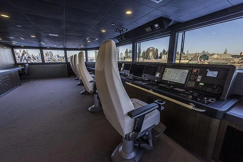 a room with a desk and chairs aboard CHARLEY Yacht for Sale