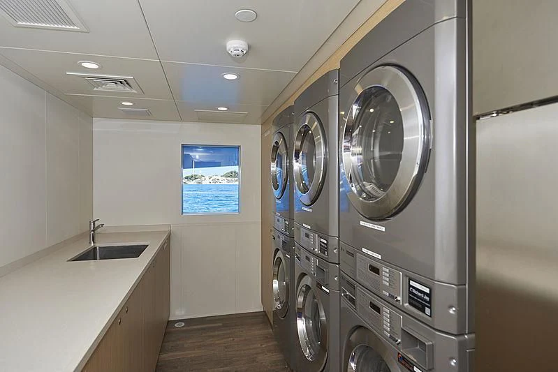 a room with a washing machine and a sink aboard CHARLEY Yacht for Sale