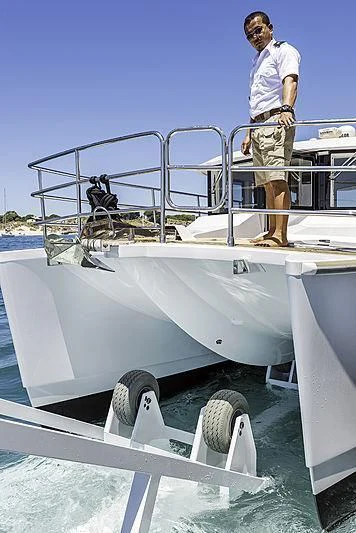 a man standing on a boat aboard CHARLEY Yacht for Sale