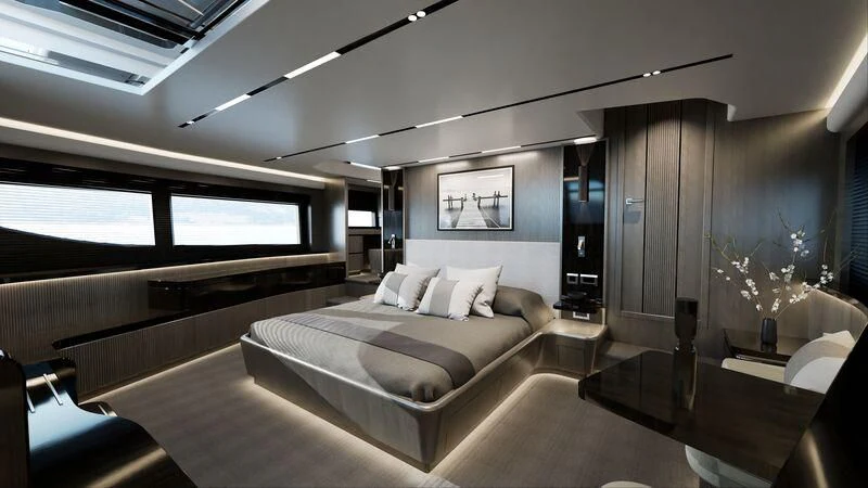 a large room with a bed and a table aboard PEARLY SPENCER Yacht for Sale