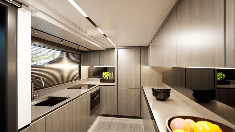 a kitchen with a large island aboard PEARLY SPENCER Yacht for Sale