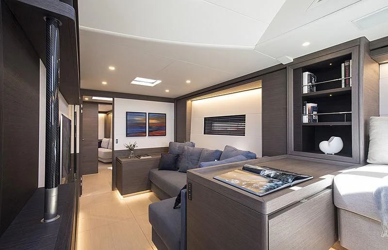 a living room with a large tv aboard SEATIUS Yacht for Sale