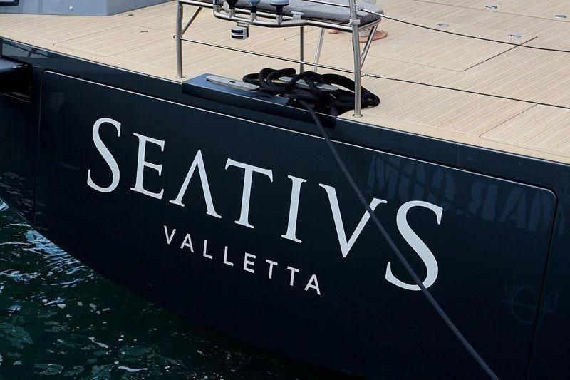 a black sign with white text aboard SEATIUS Yacht for Sale