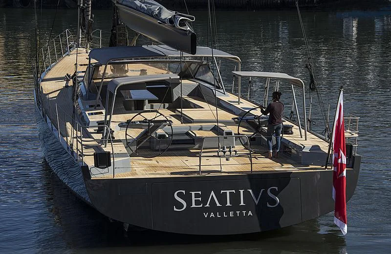 a person standing on a boat aboard SEATIUS Yacht for Sale