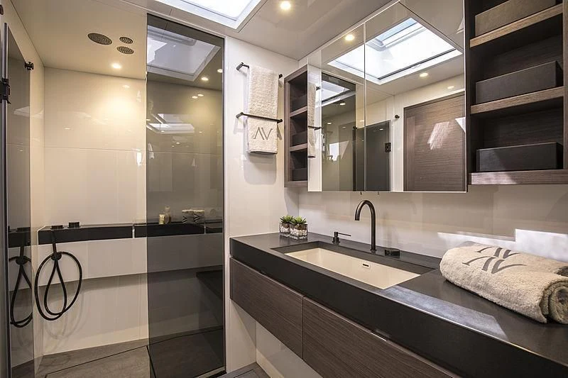 a bathroom with a sink and a mirror aboard SEATIUS Yacht for Sale