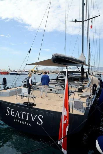 a couple of people standing on a boat aboard SEATIUS Yacht for Sale