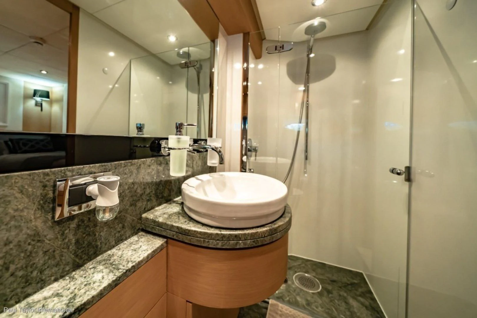 a bathroom with a large marble countertop aboard SOPHIA Yacht for Sale