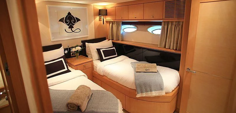 a room with a bed and a mirror aboard SOPHIA Yacht for Sale
