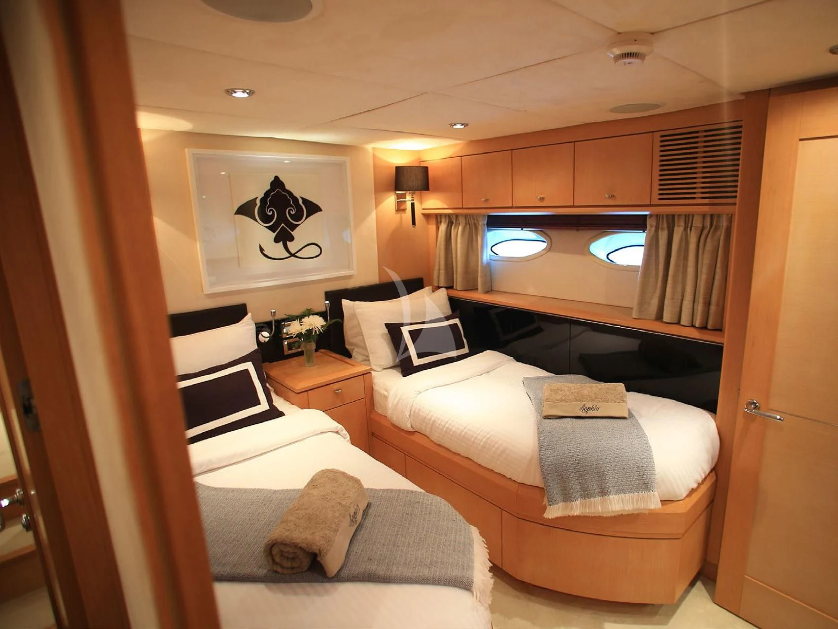a room with a bed and a window aboard SOPHIA Yacht for Sale