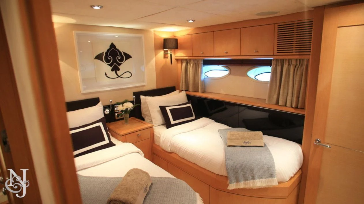 a room with two beds aboard SOPHIA Yacht for Sale