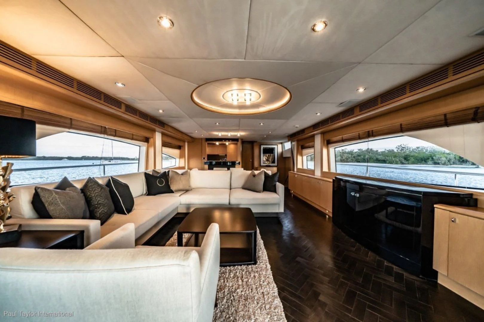 a living room with a large fireplace aboard SOPHIA Yacht for Sale