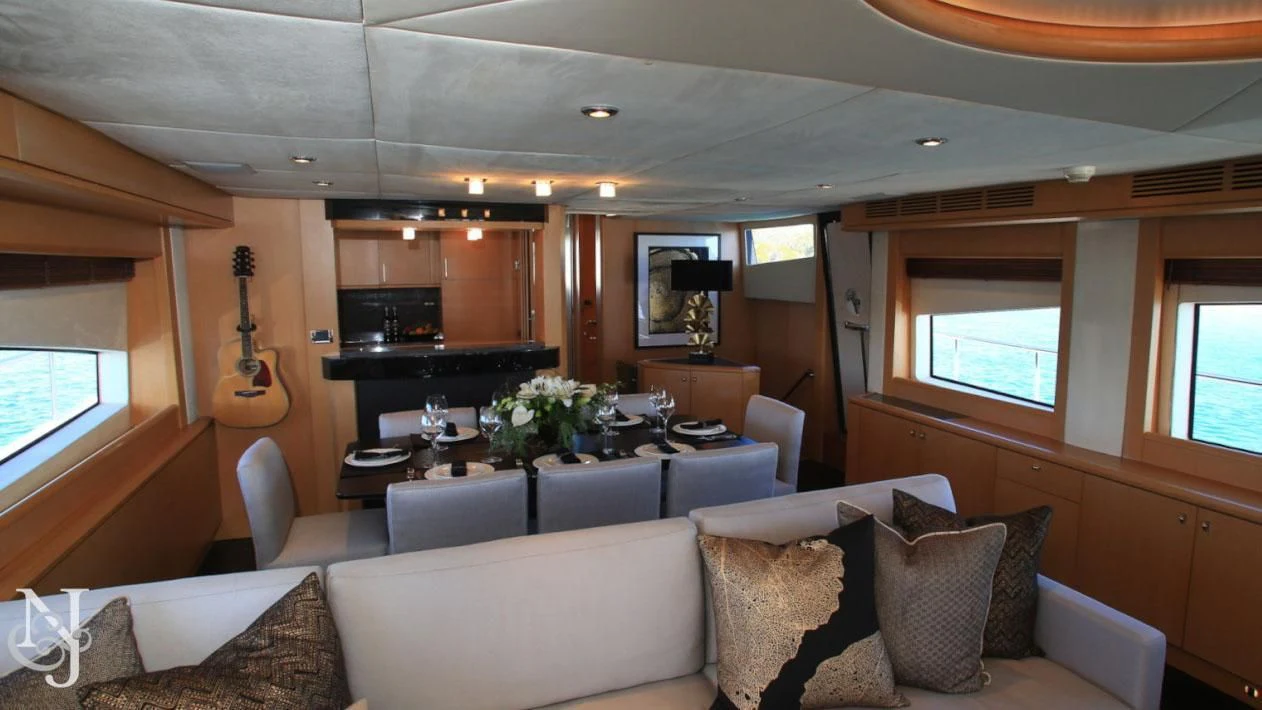 a living room with a couch and a table aboard SOPHIA Yacht for Sale