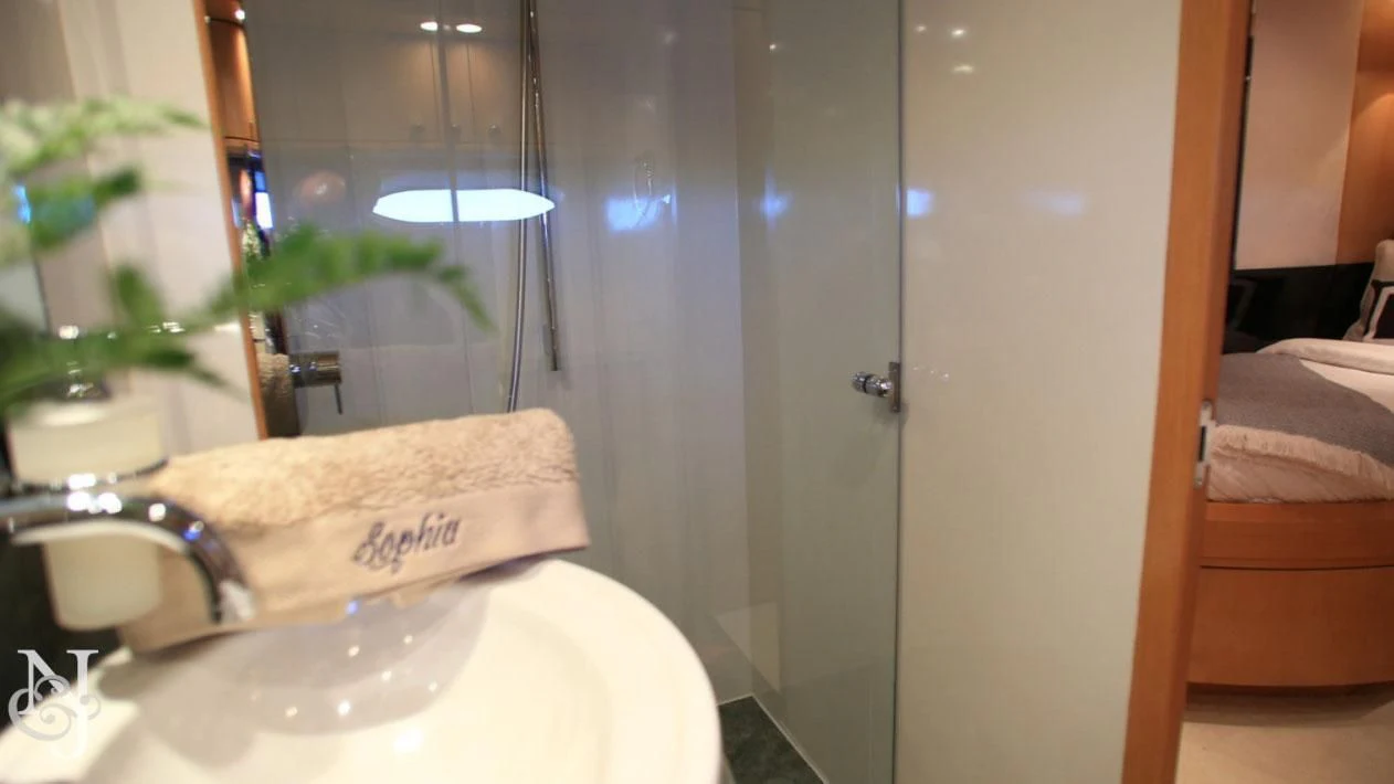a bathroom with a sink and a bathtub aboard SOPHIA Yacht for Sale