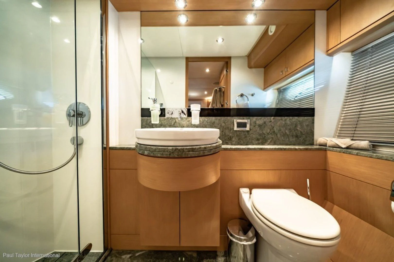 a bathroom with a large mirror aboard SOPHIA Yacht for Sale