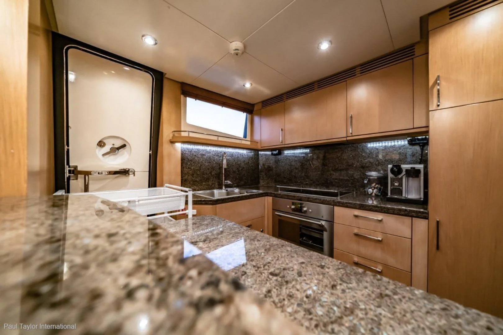 a kitchen with a marble counter top aboard SOPHIA Yacht for Sale