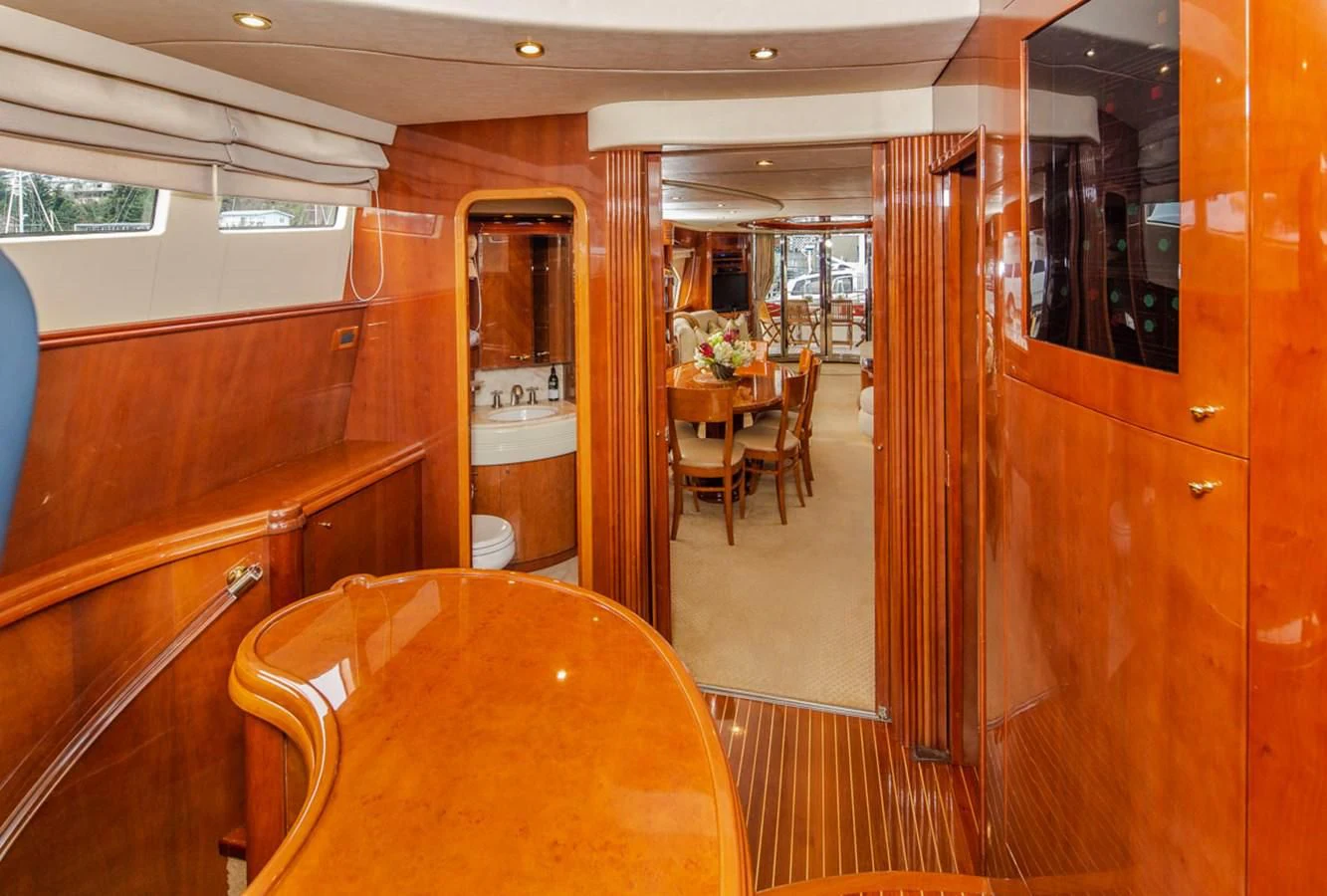 a room with a table and chairs aboard SEA HAWK Yacht for Sale