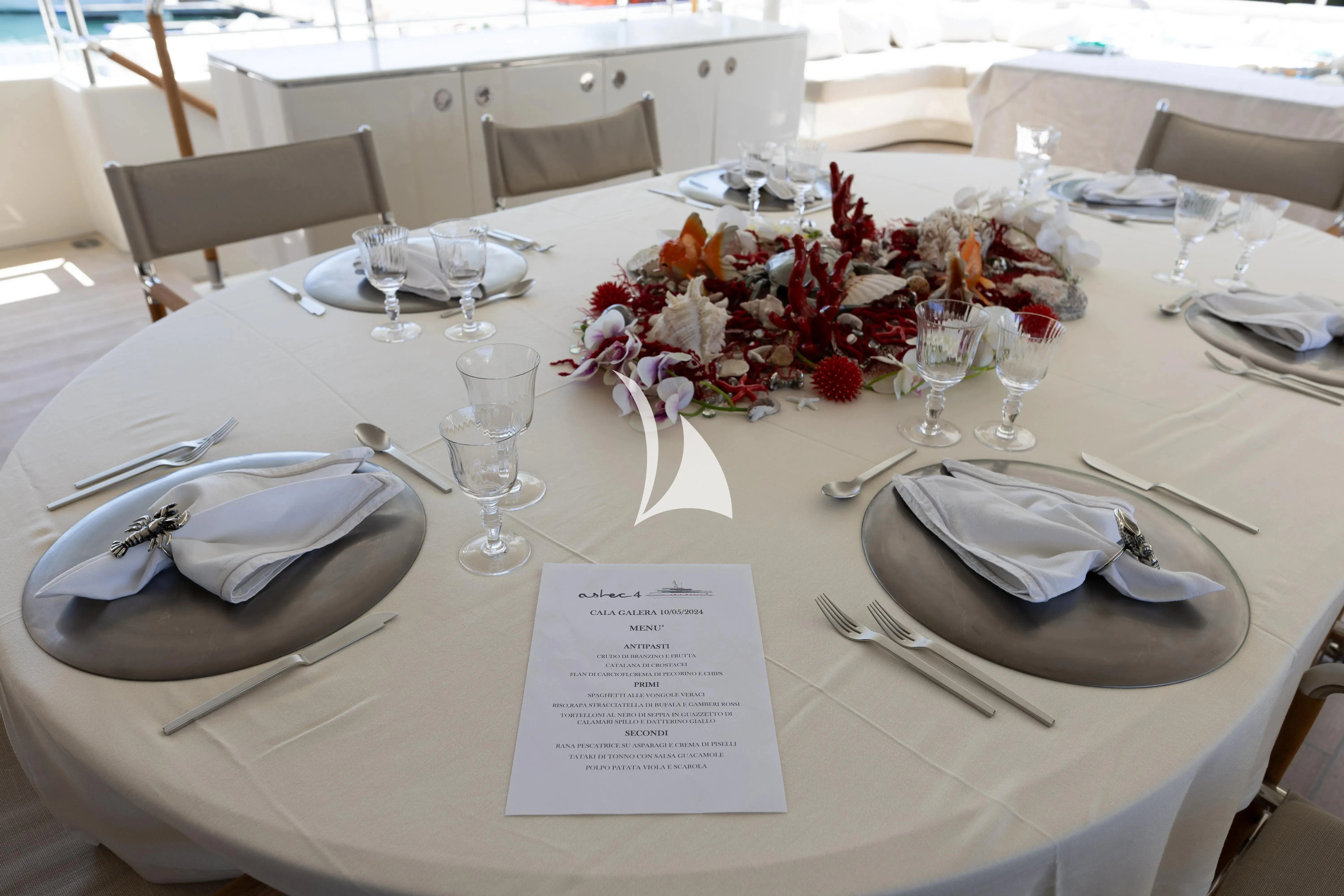 a table set with place settings aboard ASLEC 4 Yacht for Sale