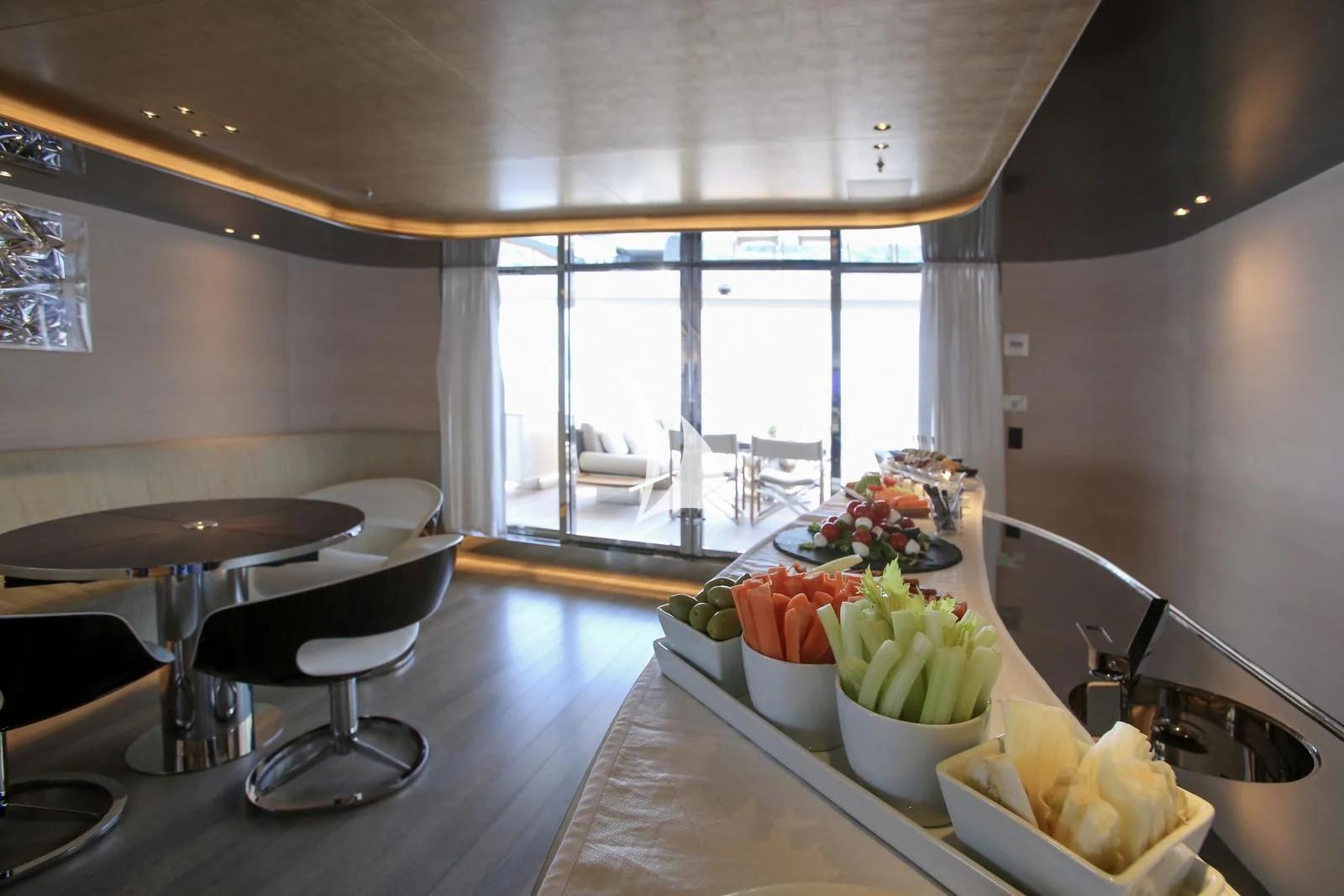 a kitchen with a table and chairs aboard ASLEC 4 Yacht for Sale