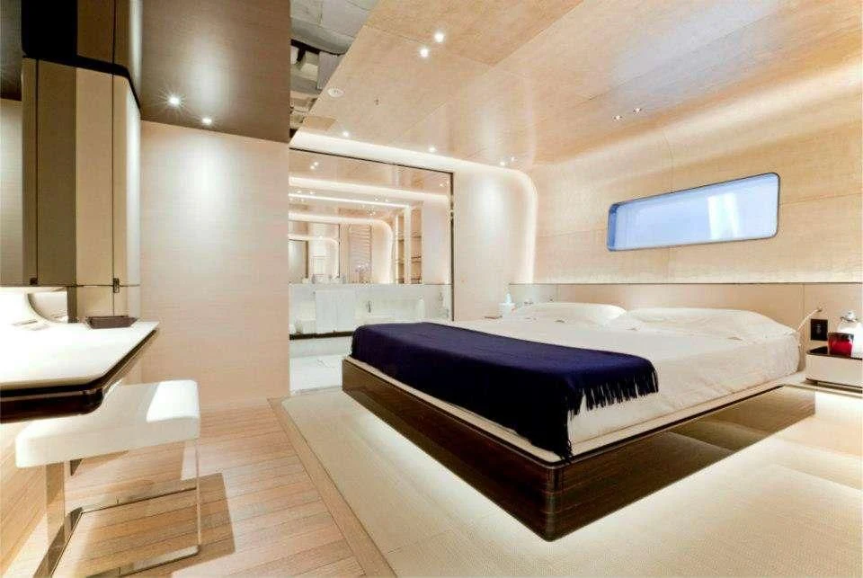 a bedroom with a bed and a desk aboard ASLEC 4 Yacht for Sale