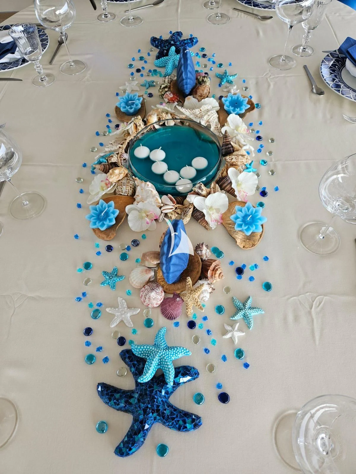 a table with a plate of food and glasses on it aboard ASLEC 4 Yacht for Sale