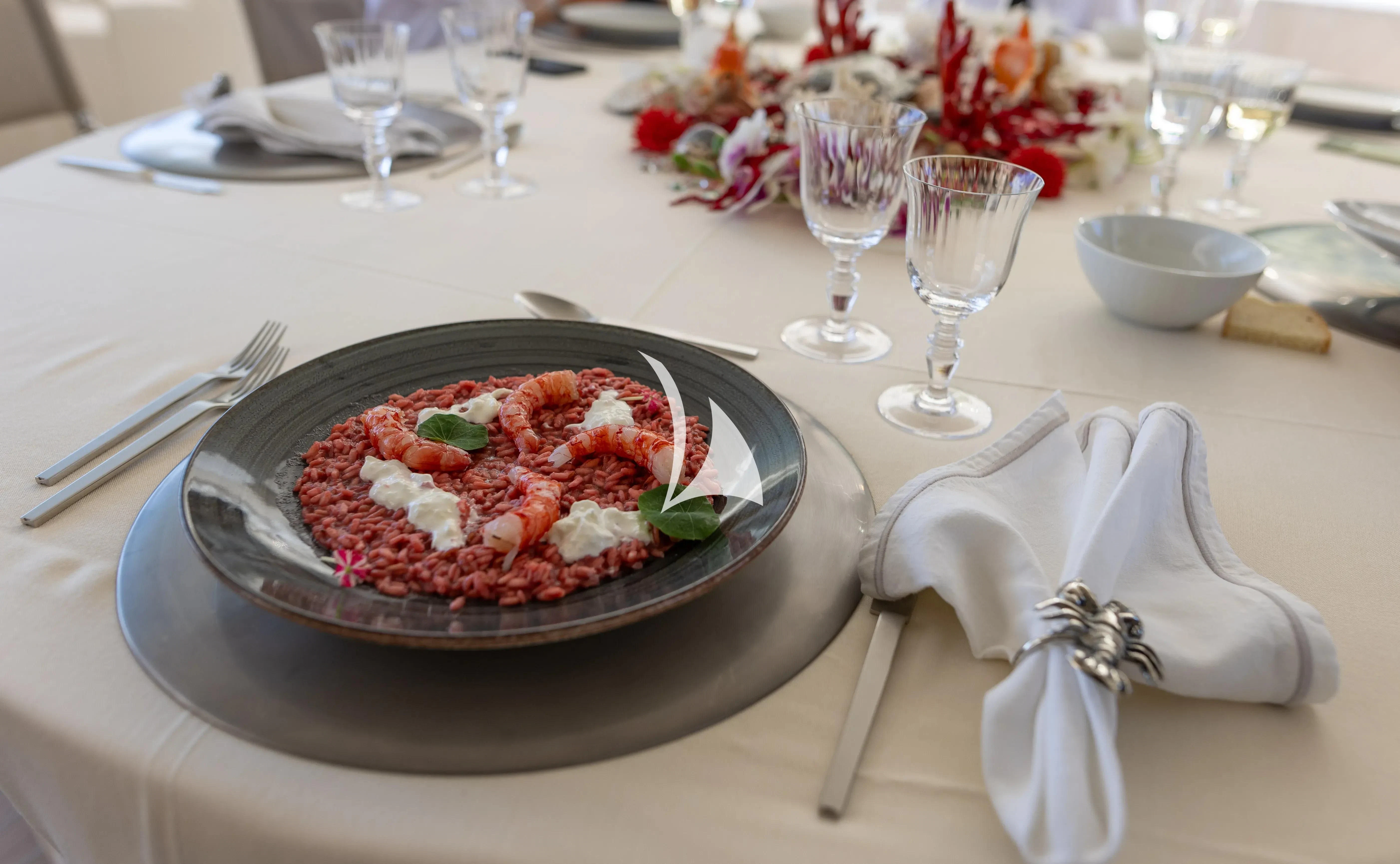 a plate of food on a table aboard ASLEC 4 Yacht for Sale