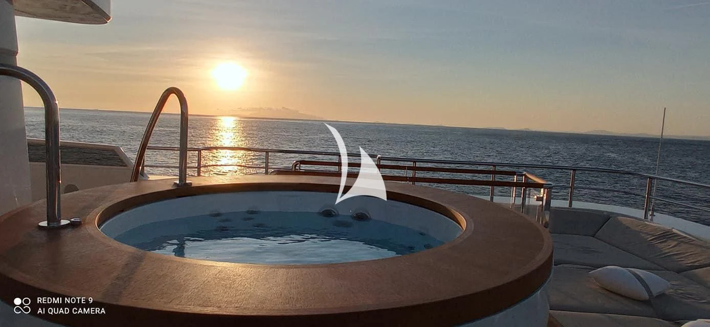 a large pool on a deck overlooking the ocean aboard ASLEC 4 Yacht for Sale