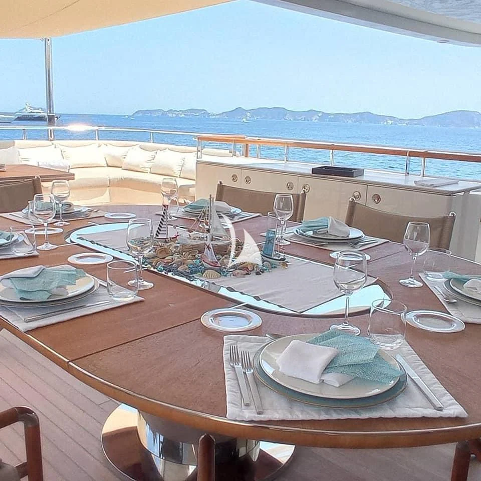 a table with plates and glasses on it aboard ASLEC 4 Yacht for Sale