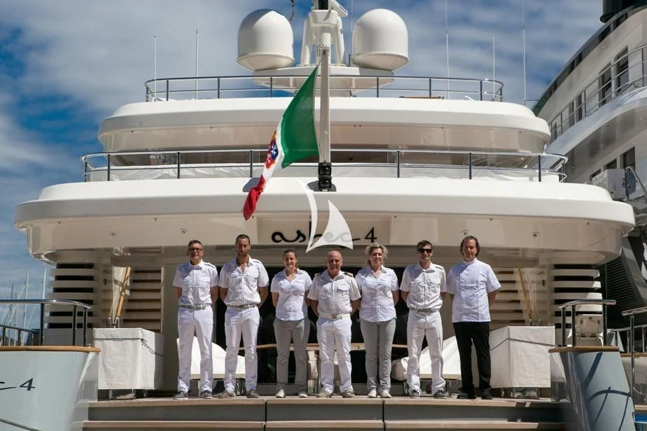 a group of men in uniform standing on a boat aboard ASLEC 4 Yacht for Sale