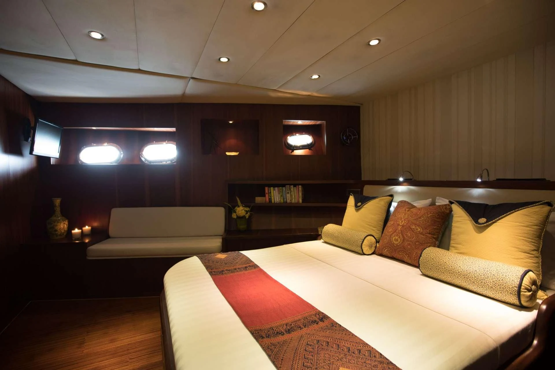 a room with a bed and a couch aboard THE BLUE Yacht for Sale