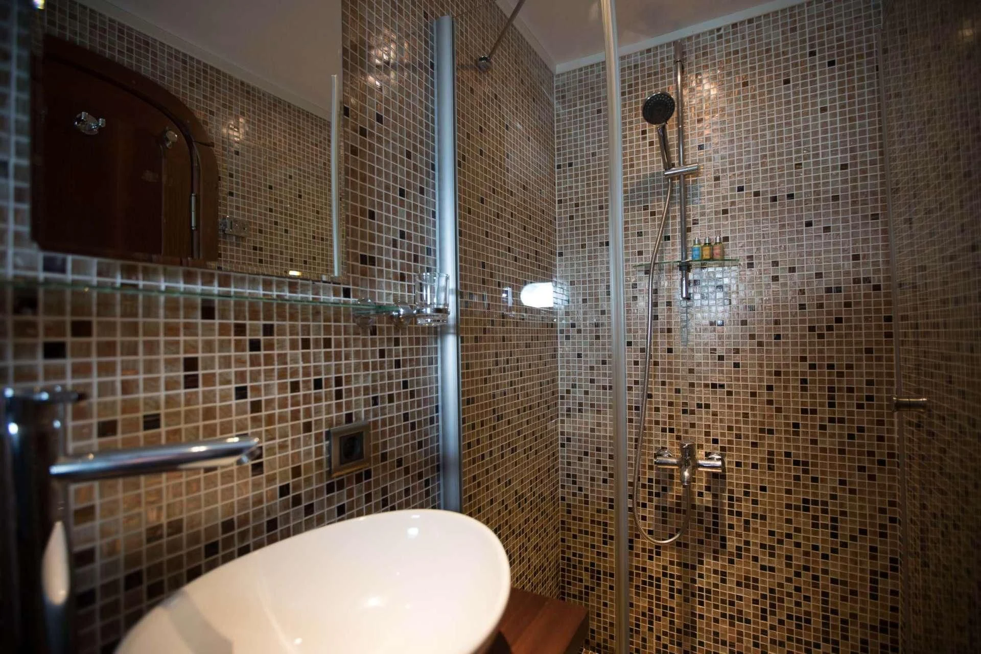 a bathroom with a shower unit and a sink aboard THE BLUE Yacht for Sale