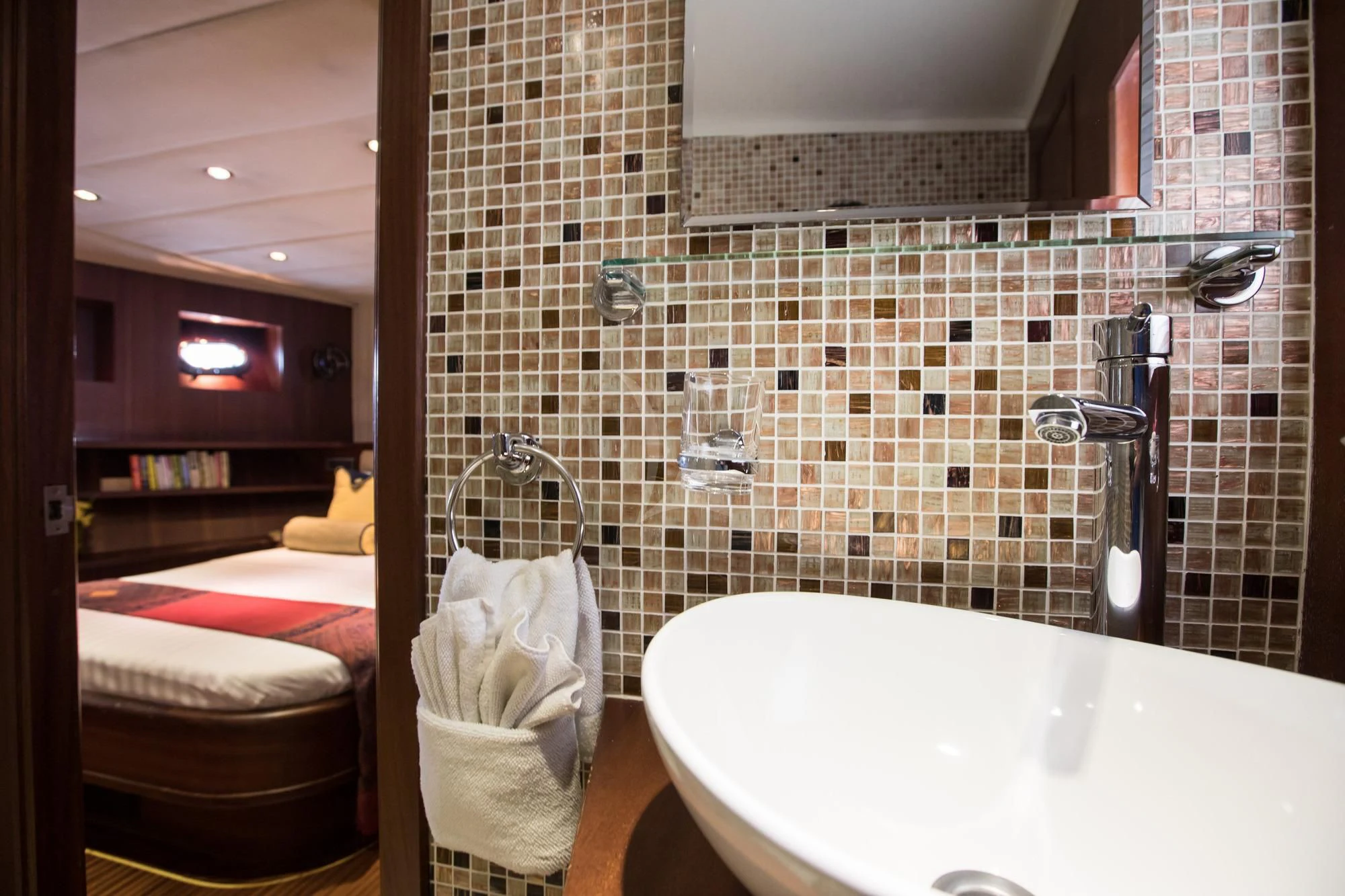 a bathroom with a bathtub and a sink aboard THE BLUE Yacht for Sale