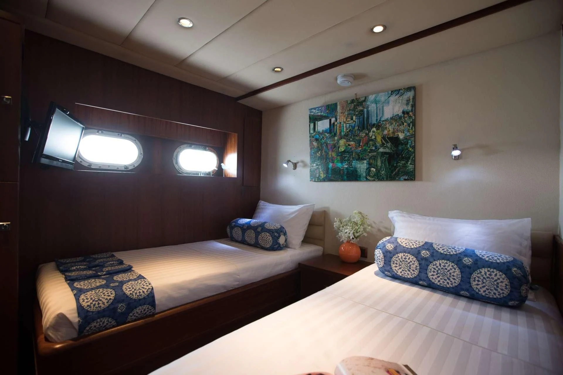 a couple of beds in a room aboard THE BLUE Yacht for Sale