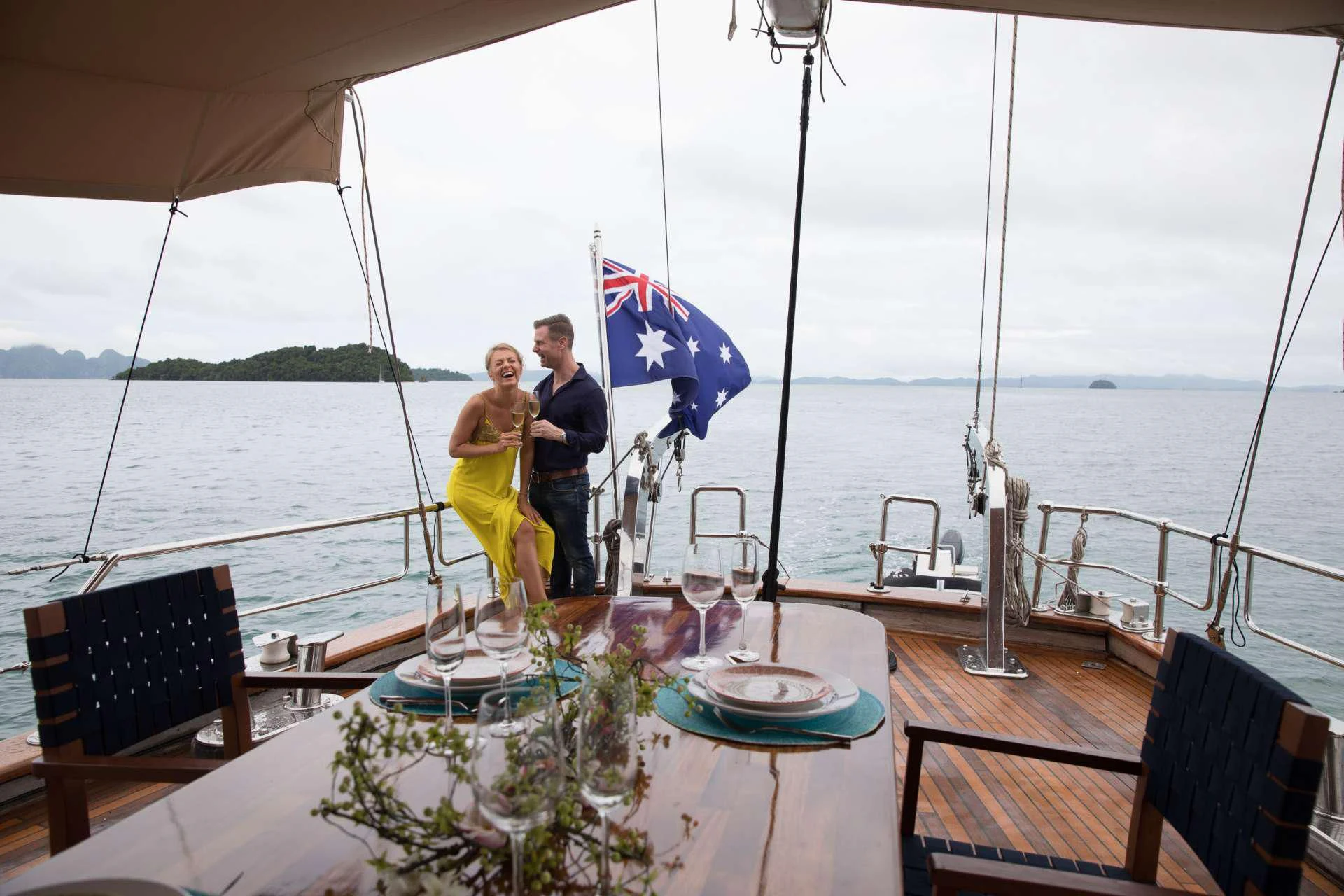 a couple standing on a boat aboard THE BLUE Yacht for Sale