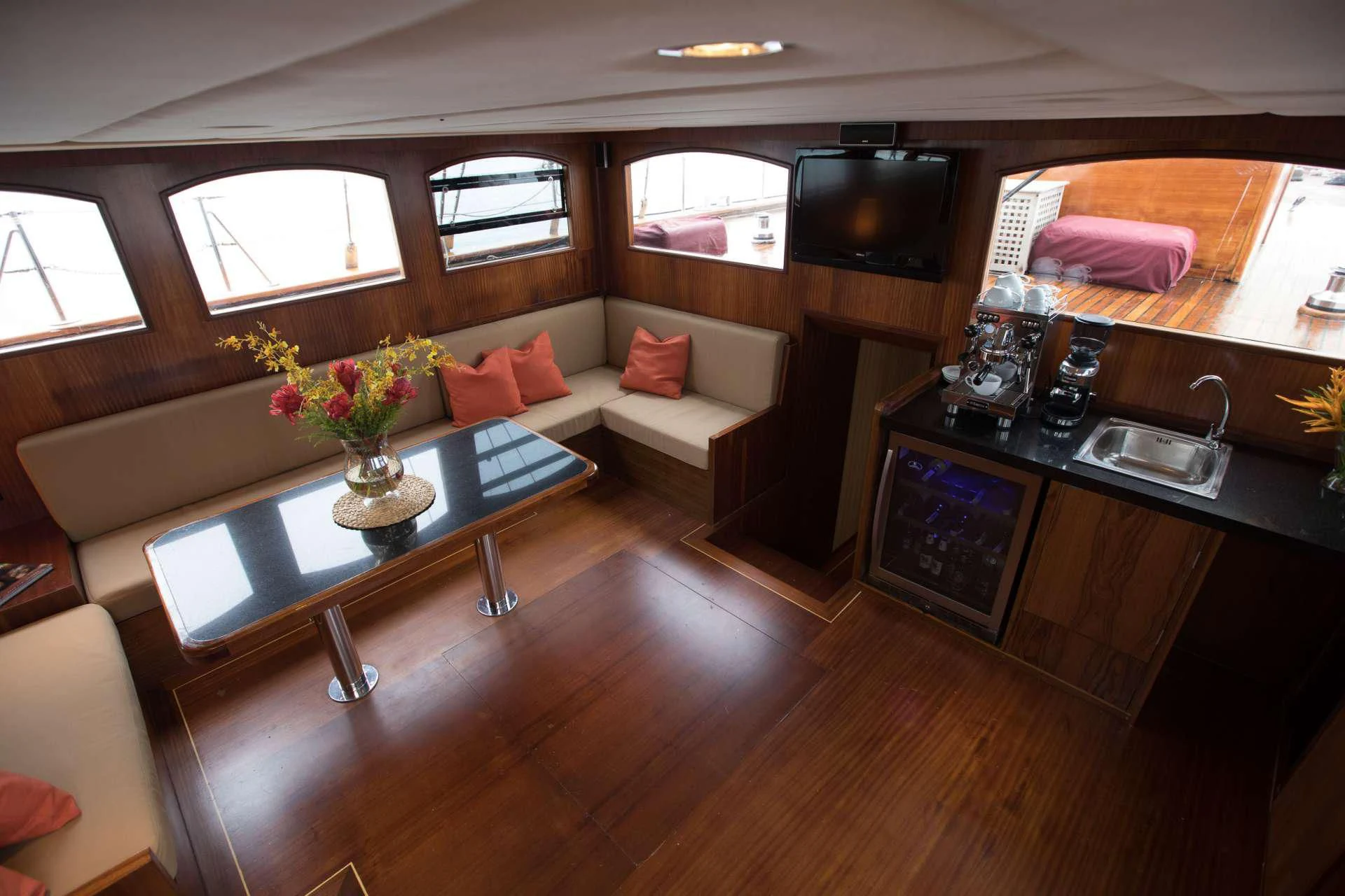 a living room with a couch and a coffee table aboard THE BLUE Yacht for Sale