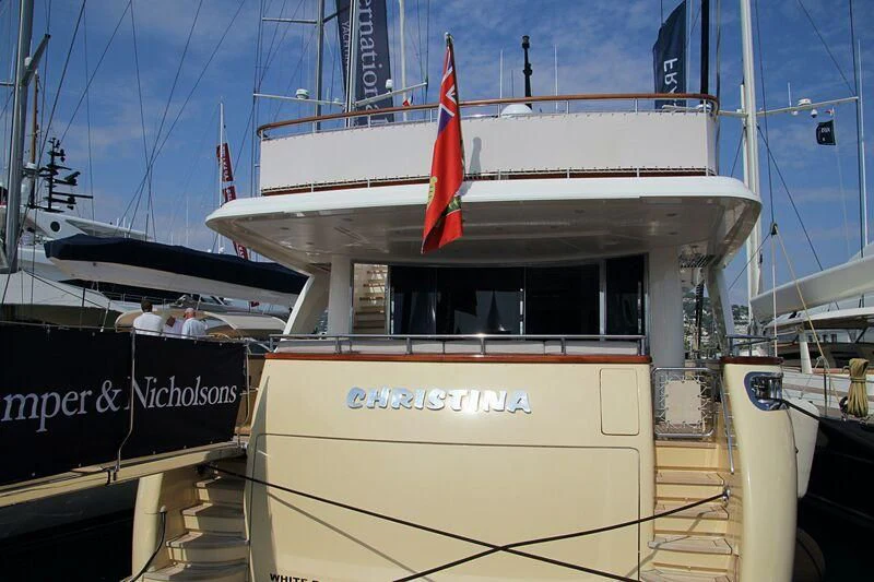 a boat with a red flag aboard LADY ALINA Yacht for Sale