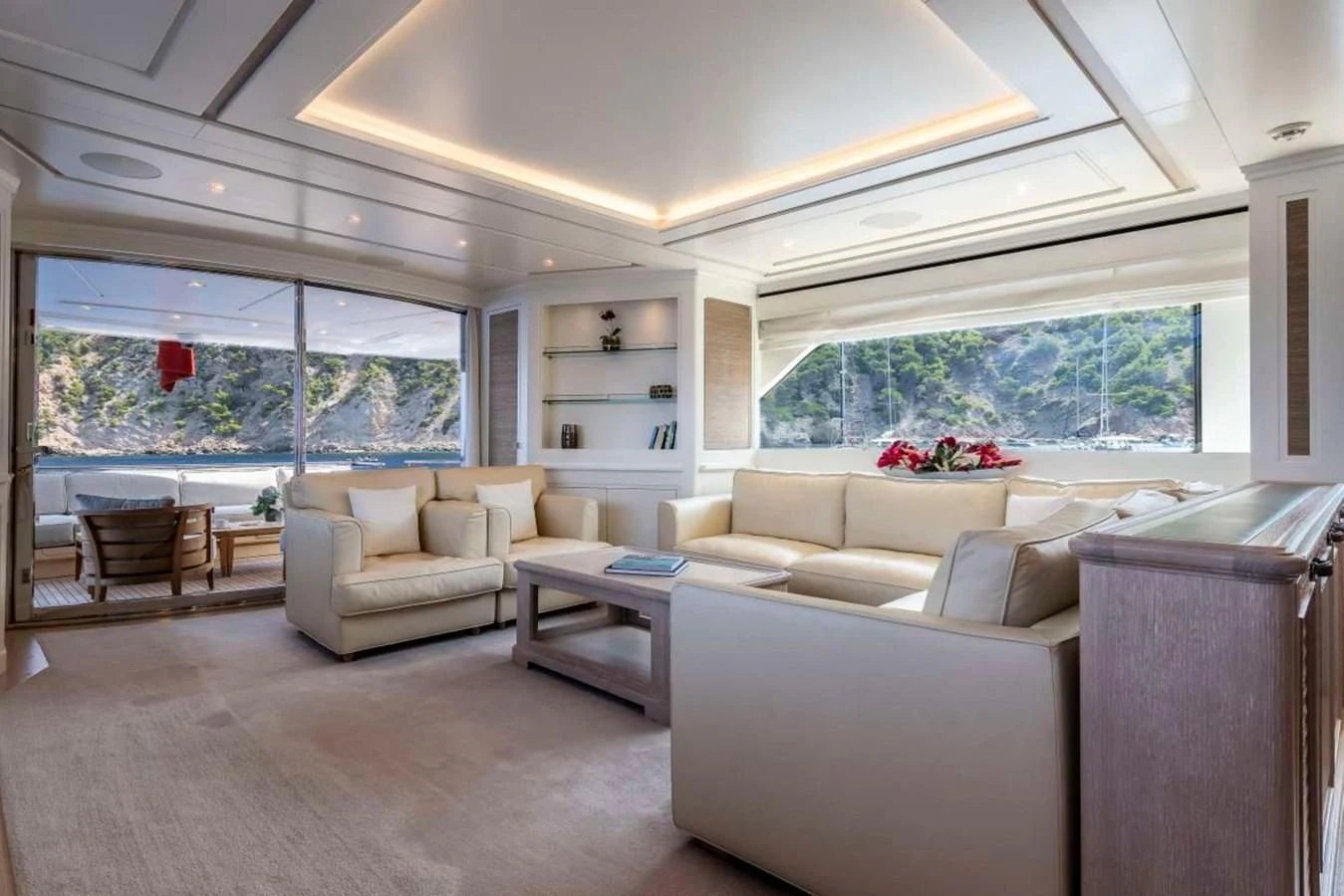 a living room with a couch and a table aboard LADY ALINA Yacht for Sale