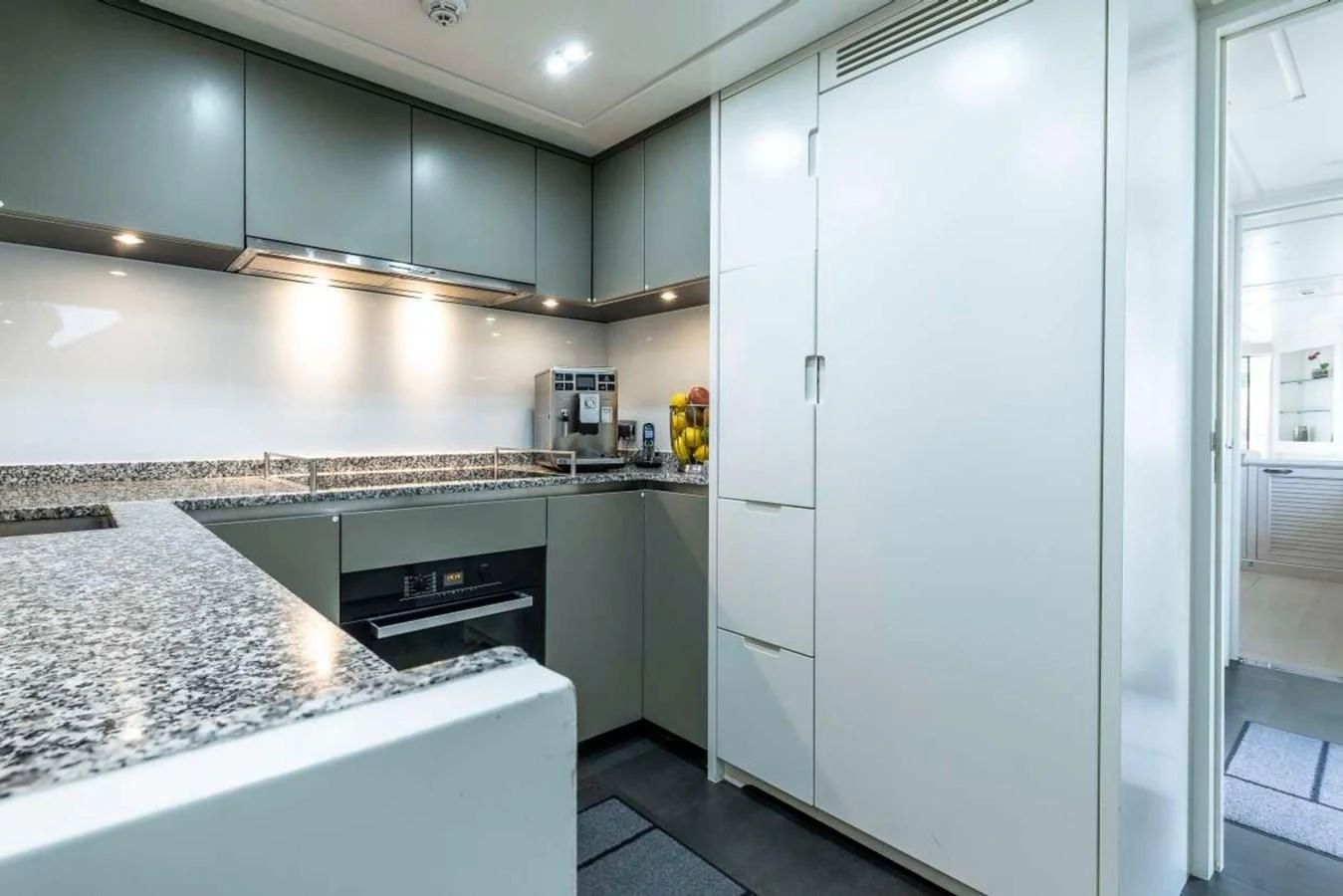 a kitchen with a large counter aboard LADY ALINA Yacht for Sale
