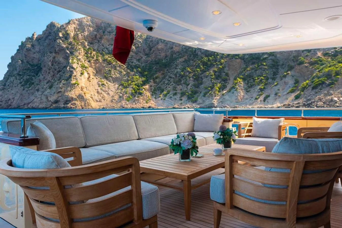 a room with a couch and a table and chairs aboard LADY ALINA Yacht for Sale