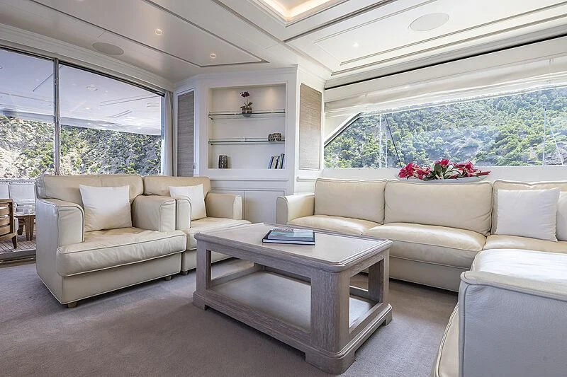 a living room with a couch and a coffee table aboard LADY ALINA Yacht for Sale