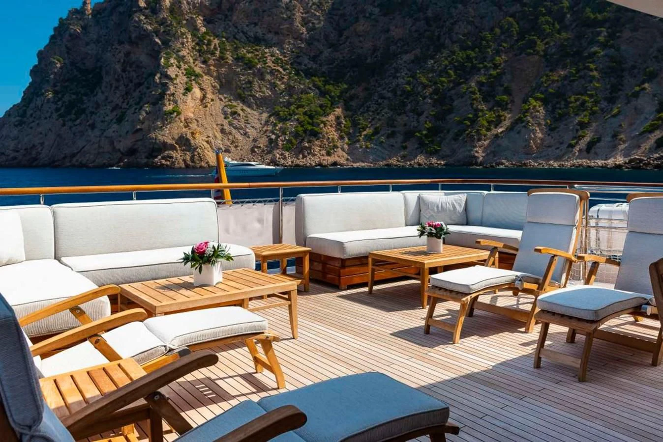 a room with tables and chairs aboard LADY ALINA Yacht for Sale