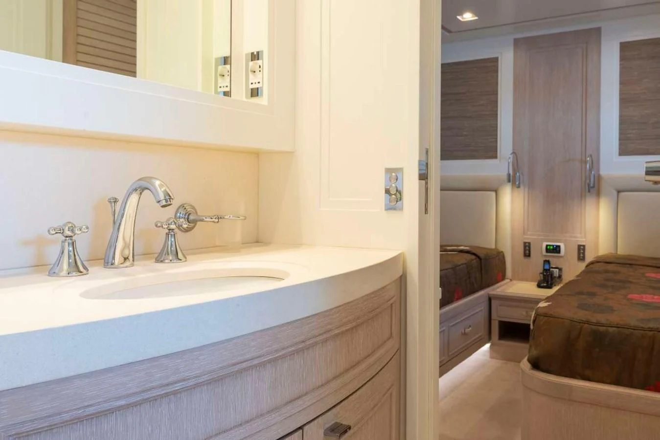a bathroom with a sink and a bed aboard LADY ALINA Yacht for Sale