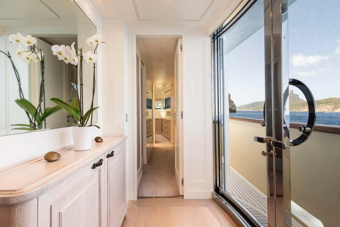 a bathroom with a sink and a door aboard LADY ALINA Yacht for Sale