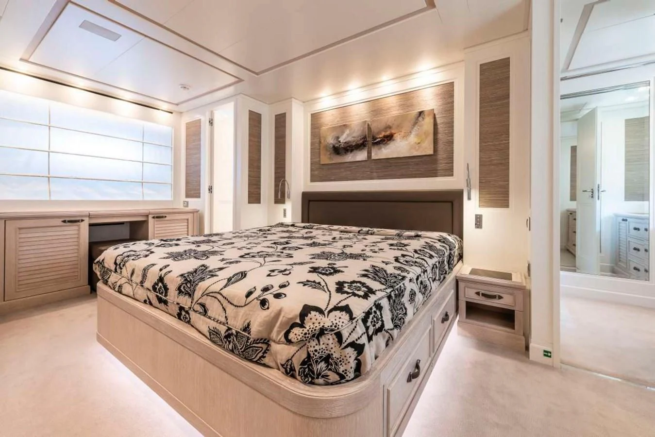 a bedroom with a large bed aboard LADY ALINA Yacht for Sale