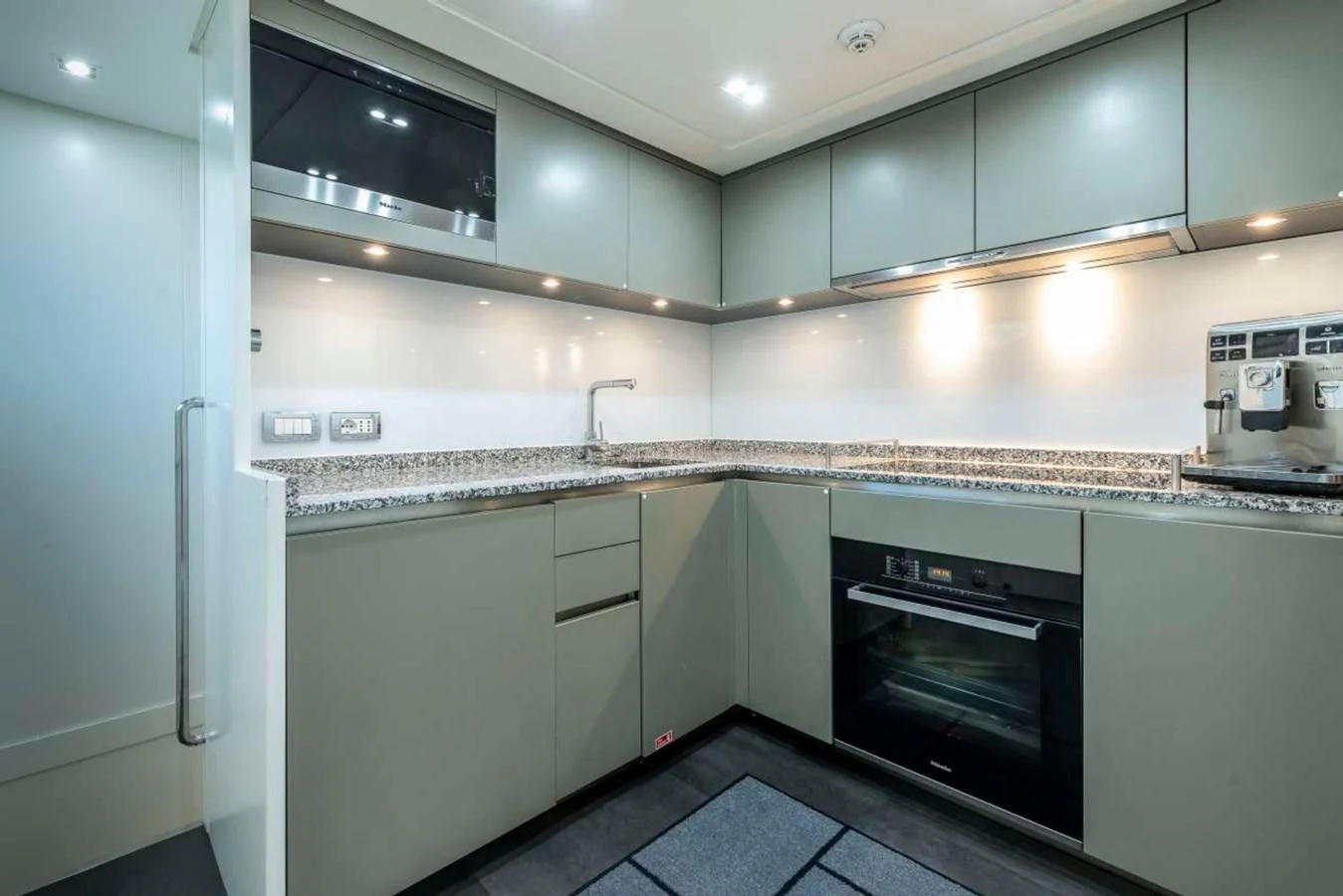 a kitchen with a stove and oven aboard LADY ALINA Yacht for Sale