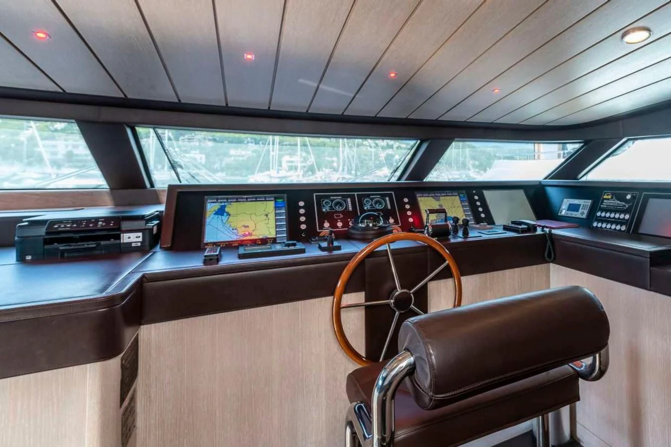 a room with a desk and chairs aboard LADY ALINA Yacht for Sale
